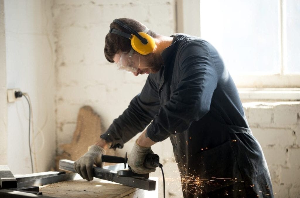 man working and wearing ear protectors