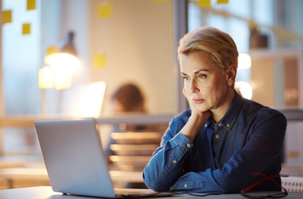 mature woman looking at laptop