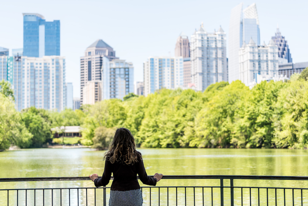 Young woman standing in Piedmont Park in Atlanta